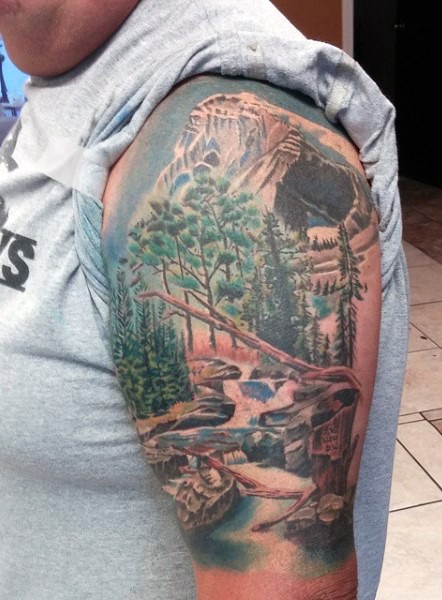 Breathtaking very detailed snowy mountain forest half sleeve tattoo
