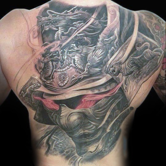 Breathtaking very detailed whole back tattoo of demonic samurai helmet