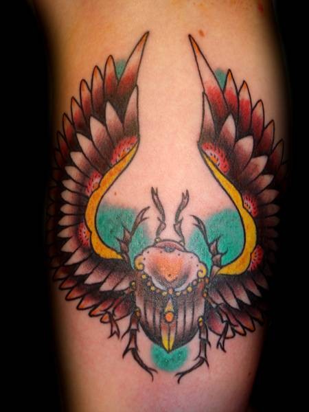 Bright colored Egyptian scarab detailed tattoo in old school style