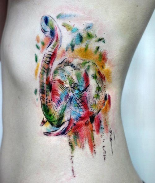 Bright multicolored elephant side tattoo in watercolor style