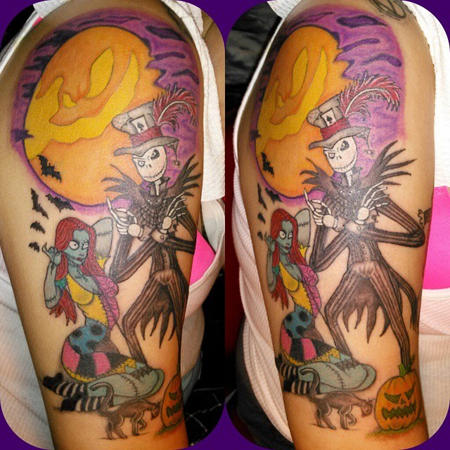 Brilliant looking colored monster couple tattoo on shoulder with cat and bats