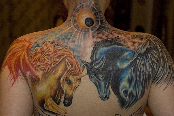 Brilliant looking multicolored fantasy horses tattoo on back and shoulder with nice sun