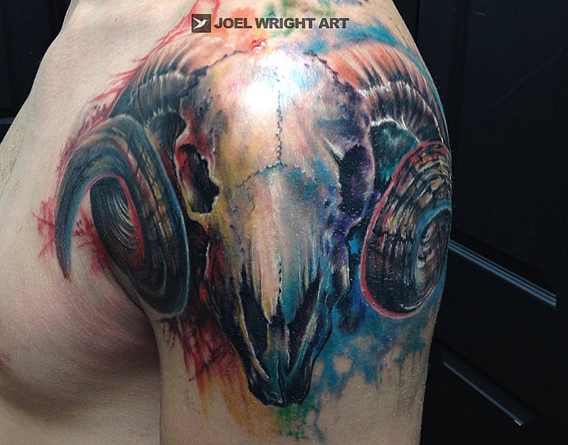 Brilliant painted and colored shoulder tattoo of goat skull