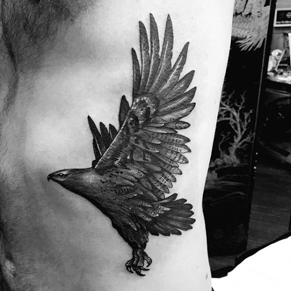 Brilliant painted and detailed little black and white eagle tattoo on side
