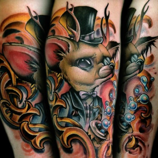 Brilliant painted colorful mystical forearm tattoo of fantasy creature in hat