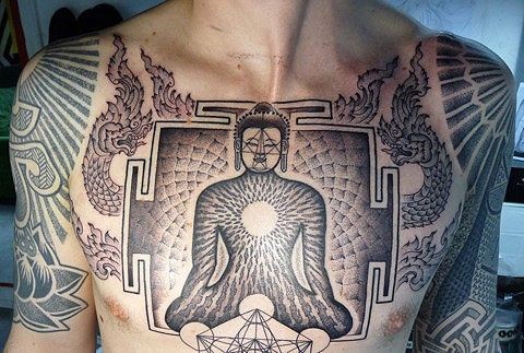 Buddha and buddhist symbolism tattoo on chest