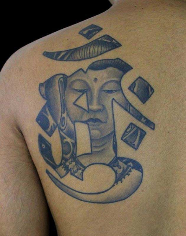 Buddha and hieroglyph tattoo on shoulder blade