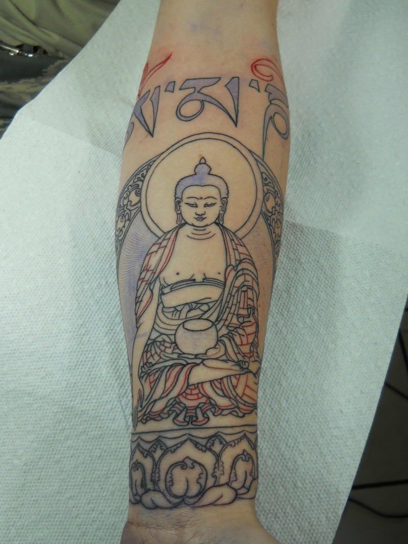 Buddha tattoo on arm