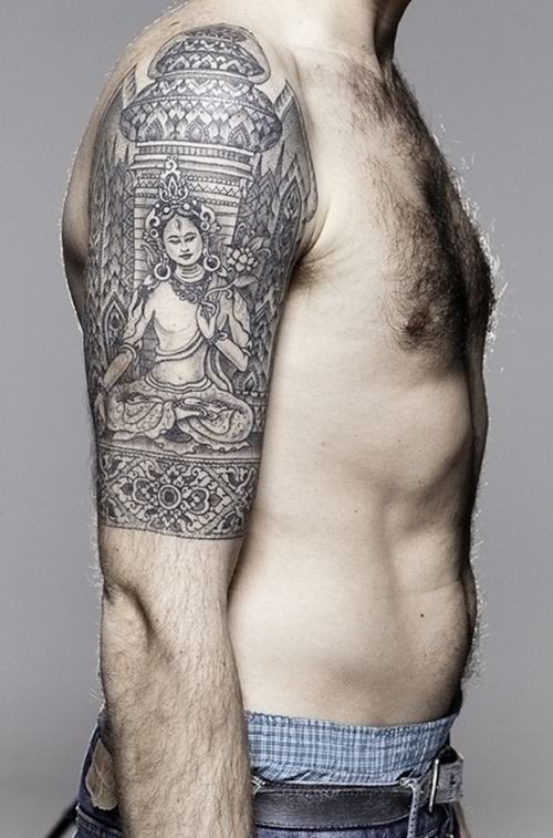 Buddhist tattoo style on arm