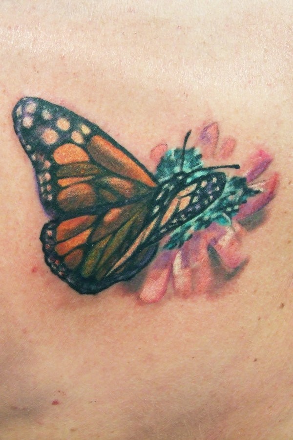 Butterfly on flower tattoo