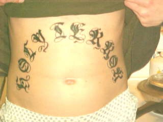 Calligraphy writing tattoo on belly