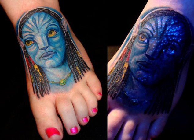 Carelessly painted and colored glowing foot tattoo of Avatar hero portrait