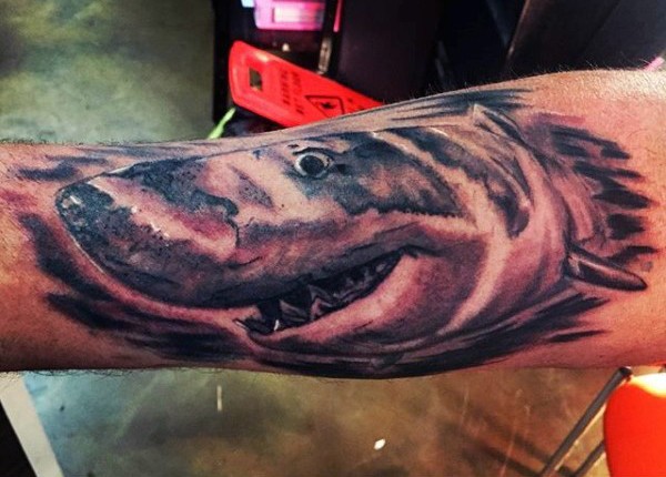 Carelessly painted big shark tattoo on leg