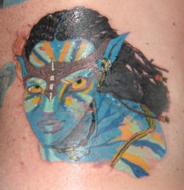 Carelessly painted colored little Avatar woman hero tattoo