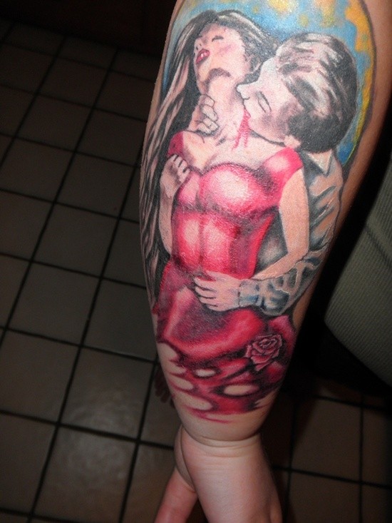 Carelessly painted colored vampire and his victim tattoo on forearm with flower
