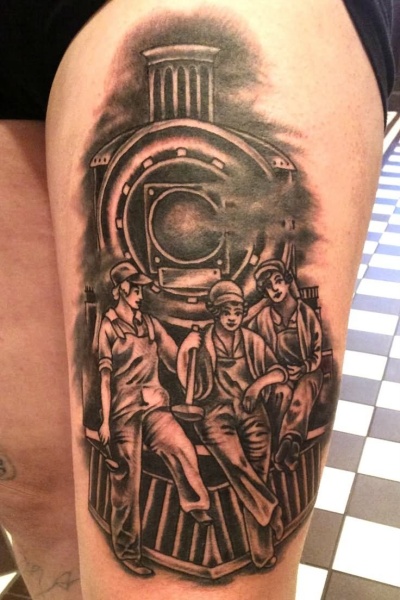 Carelessly painted detailed thigh tattoo of train with workers