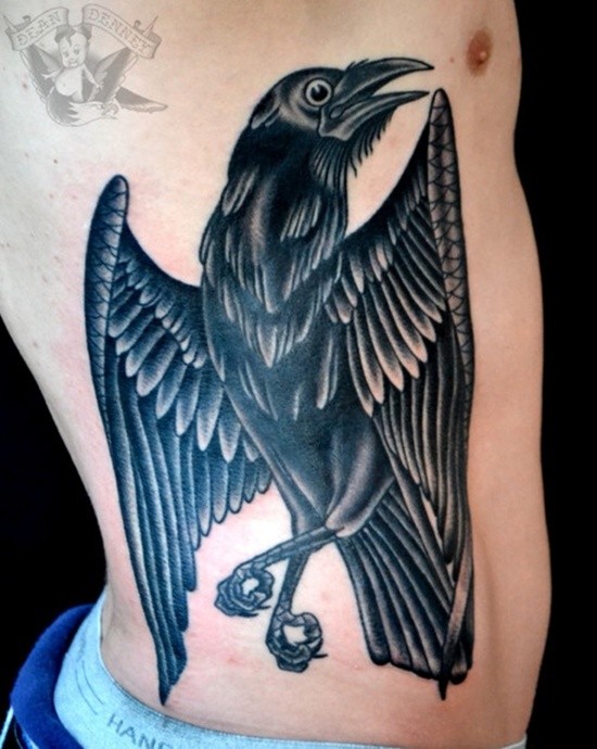 Cartoon like colored and detailed crow tattoo on side