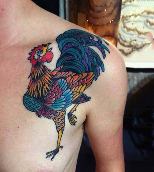 Cartoon like colored dancing cock tattoo on chest