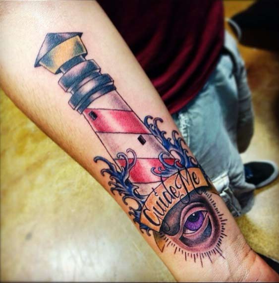 Cartoon like colored forearm tattoo of lighthouse with lettering and mystic eye