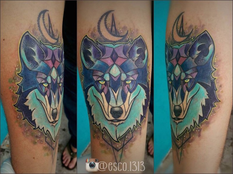 Cartoon like colored forearm tattoo of wolf head with moon