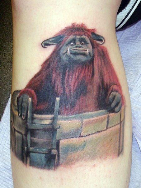 Cartoon like colored funny monster tattoo on leg