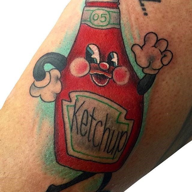 Cartoon like colored leg tattoo of ketchup bottle