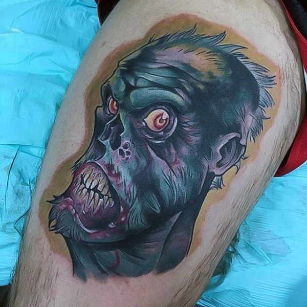 Cartoon like colored thigh tattoo of funny zombie face