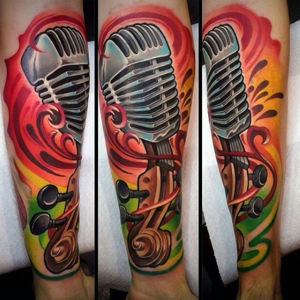 Cartoon like colored vintage microphone with violin tattoo on arm
