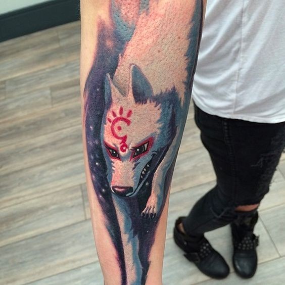Cartoon like colored white wolf tattoo on forearm with red mystical symbol