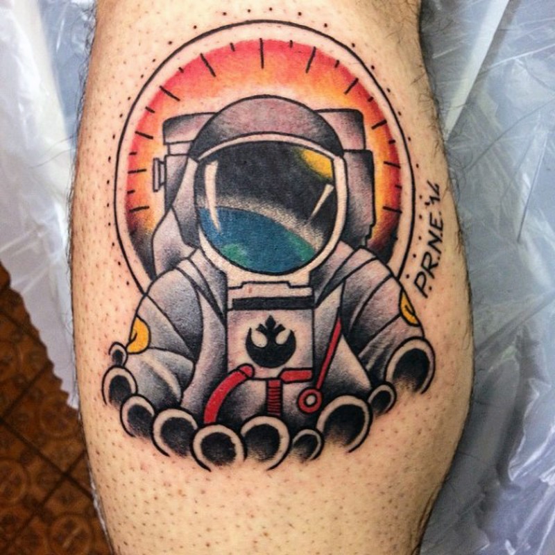 Cartoon like multicolored astronaut tattoo on leg