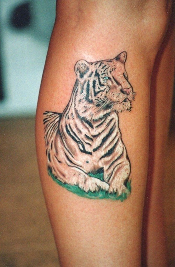 Cartoon like multicolored leg tattoo of white tiger