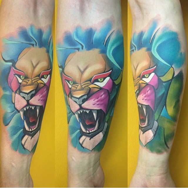 Cartoon style amazing colored roaring lion tattoo on forearm