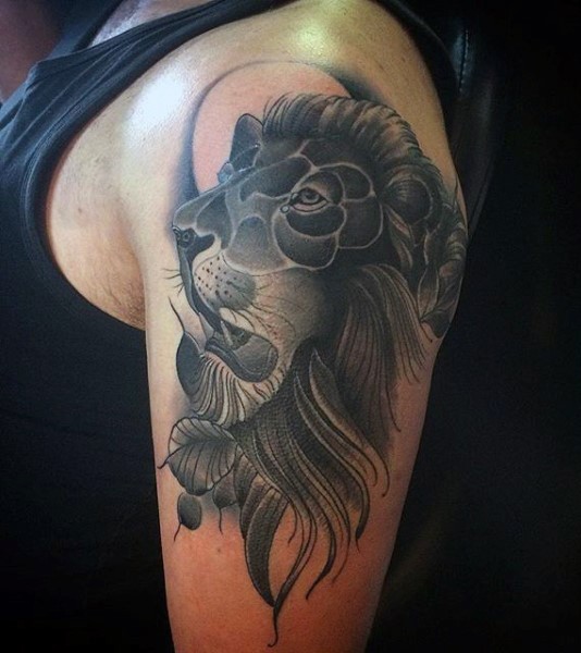 Cartoon style black and white shoulder tattoo of lion head