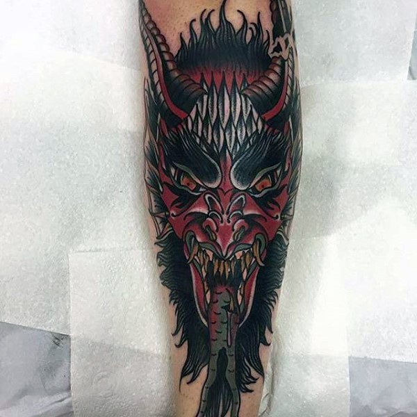 Cartoon style colored arm tattoo of big devils face