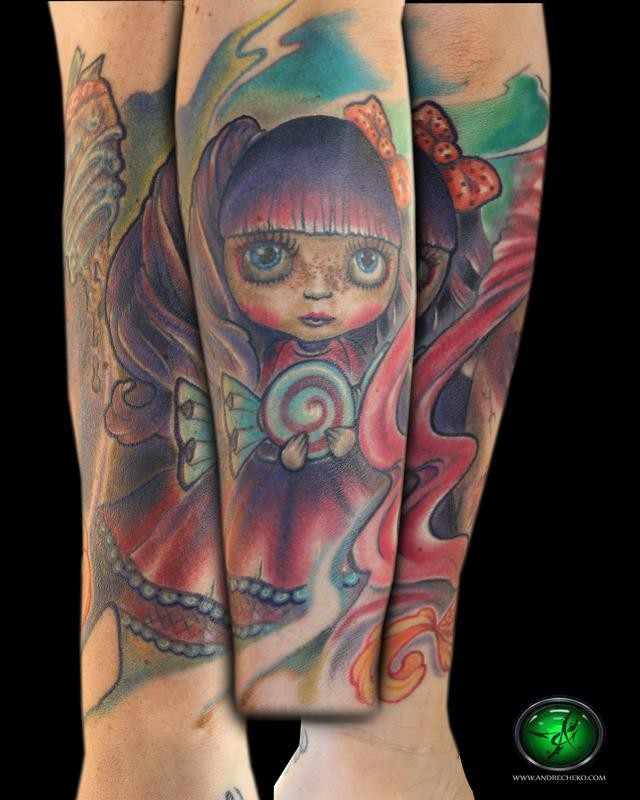Cartoon style colored arm tattoo of cute doll with candy