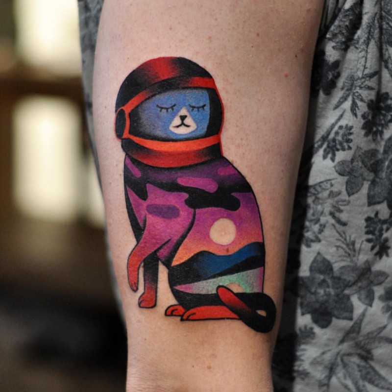 Cartoon style colored arm tattoo of space cat by David Cote