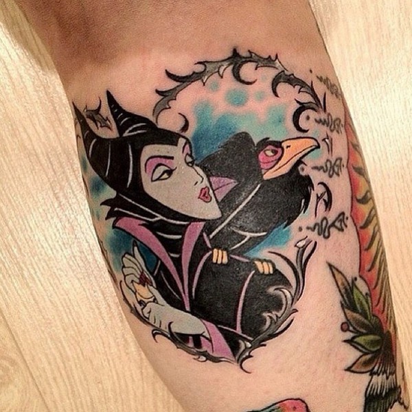 Cartoon style colored arm tattoo of woman witch with crow