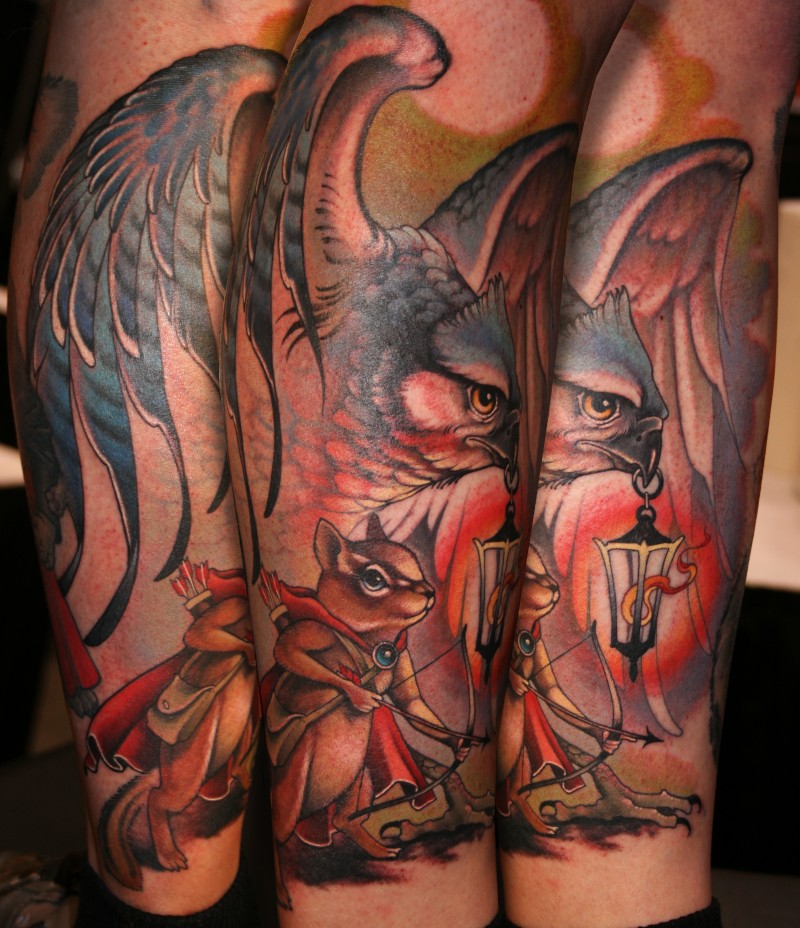 Cartoon style colored fantasy eagle tattoo on leg combined with mouse archer