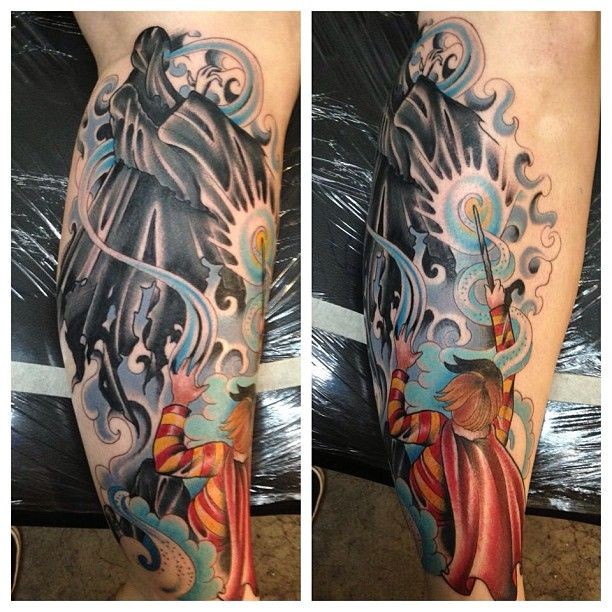 Cartoon style colored fantasy wizard fight tattoo on leg