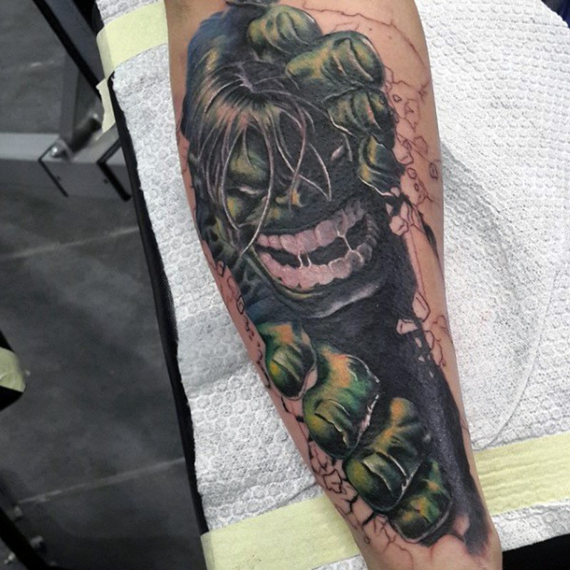 Cartoon style colored forearm tattoo of evil Hulk portrait