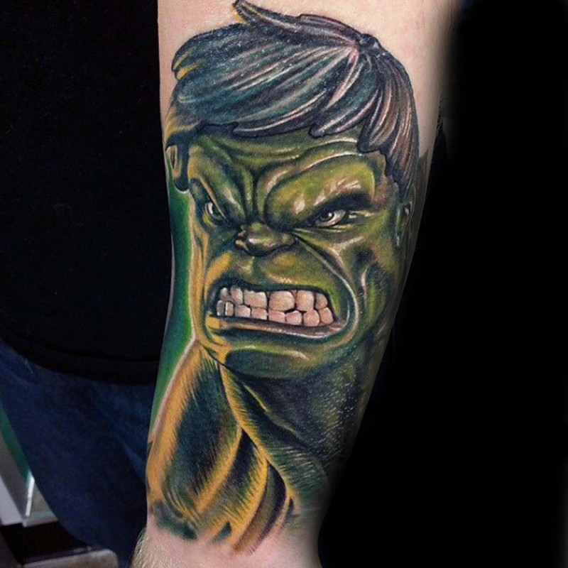 Cartoon style colored forearm tattoo of angry Hulk face