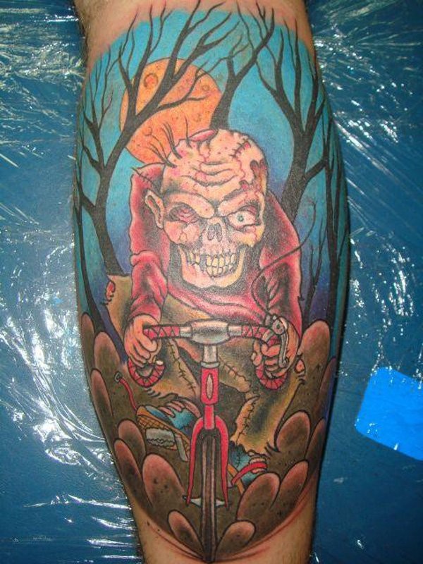 Cartoon style colored leg muscle tattoo of zombie bicycle rider