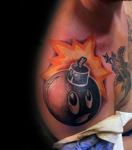 Cartoon style colored shoulder tattoo of funny bomb