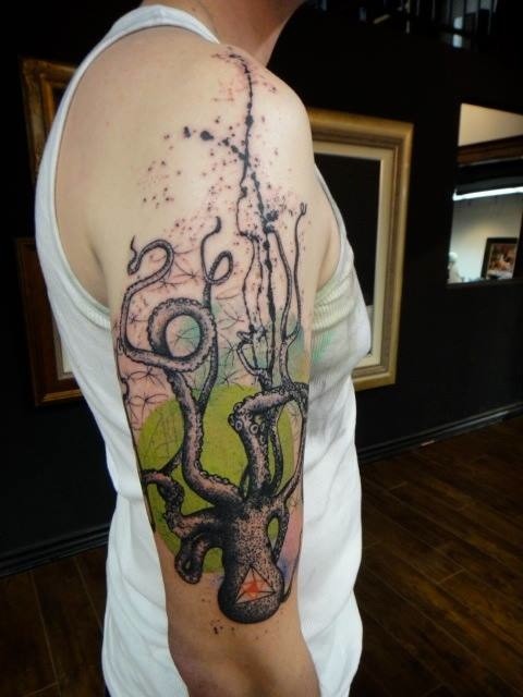 Cartoon style colored shoulder tattoo of big octopus