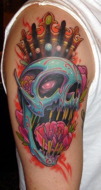 Cartoon style colored shoulder tattoo of fantasy skull with crown