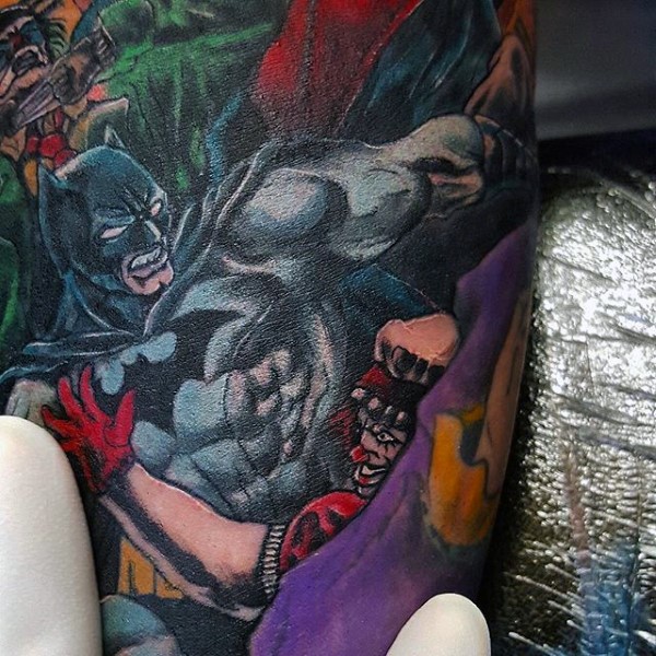 Cartoon style colored tattoo of Batman fighting villains
