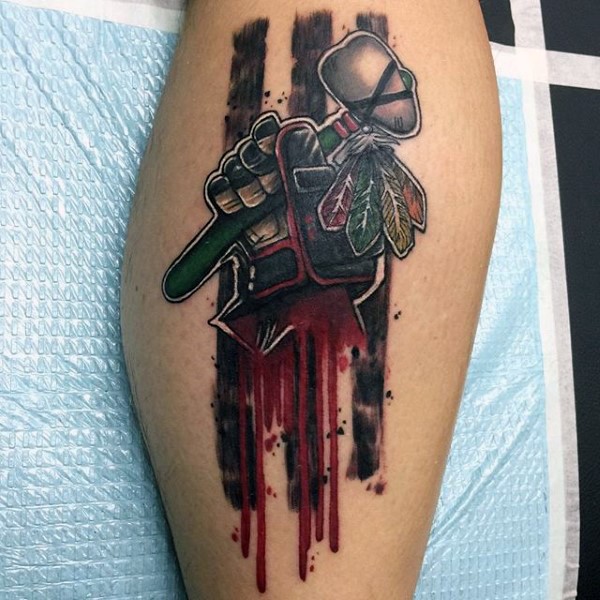 Cartoon style colored tattoo of bloody hand with Indian axe