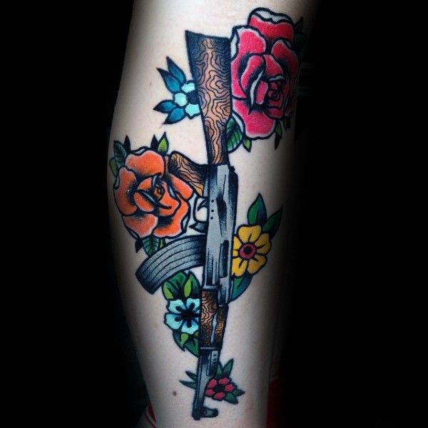 Cartoon style colored tattoo of various flowers and AK rifle