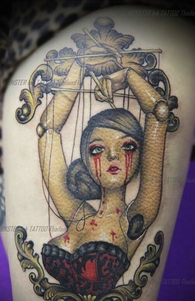Cartoon style colored thigh tattoo female puppet