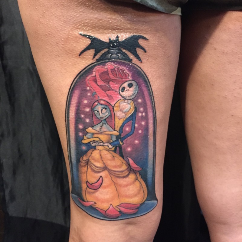 Cartoon style colored thigh tattoo of Nightmare before Christmas heroes